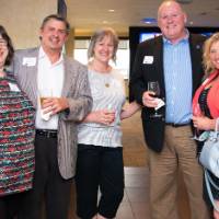 5 people pose for picture